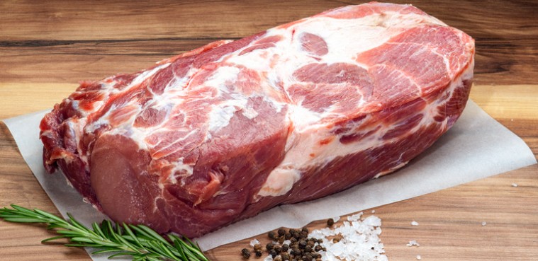 Fresh bone-in pork shoulder (Boston butt) on butcher paper